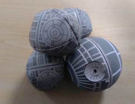 photo of death star toy balls on a desk