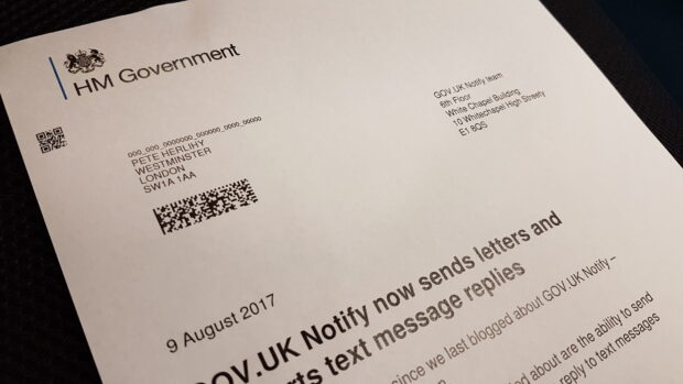 A letter sent from the GOV.UK Notify team sits on a table