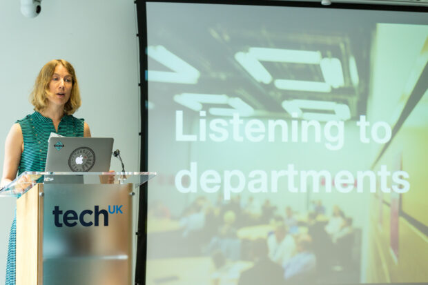 Hazel Hobbs presenting to an audience at techUK